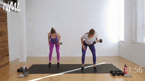 two women performing a single arm reverse grip back row and bicep curl and rotational shoulder press in an arm and shoulder workout
