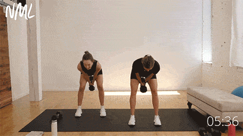 two women performing dumbbell swings to target hamstrings and glutes 