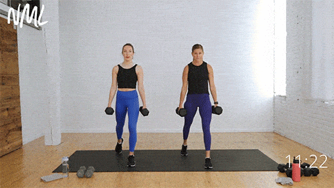 two women performing a split lunge exercise to target legs and back