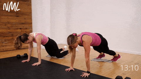 two women performing aa 3-second side plank hold and 3 towel knee tucks in a legs and abs workout