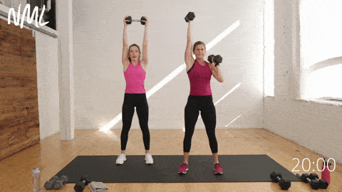two women performing a dumbbell squat thruster in a full body functional strength workout