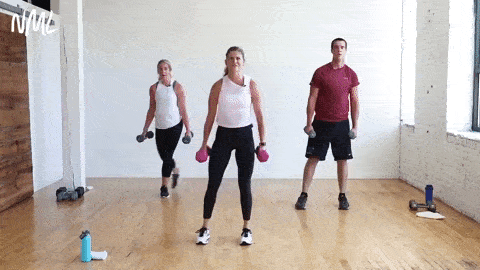three people performing a curtsy lunge and bicep curl and squat in a circuit training workout