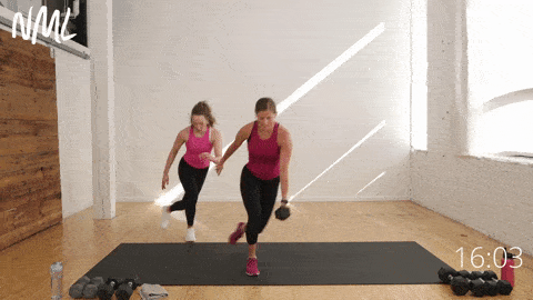 two women performing a curtsy lunge in a full body functional strength workout