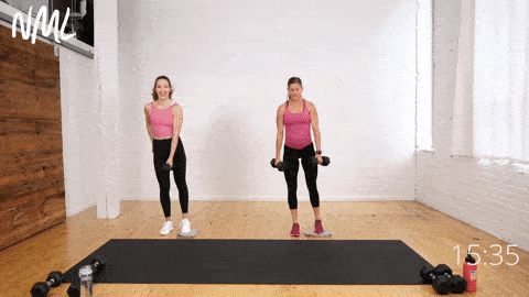 two women performing a lateral lunge with a glider in a legs, thighs and abs workout
