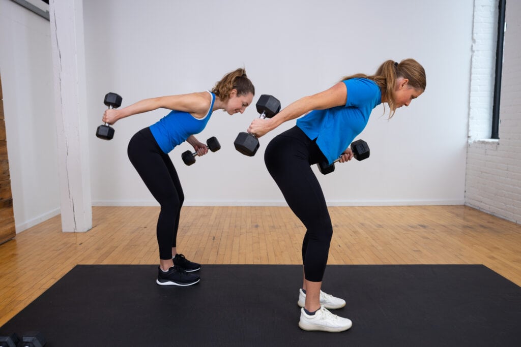 two women performing tricep kickbacks as part of back and arm workout. During the best arm workouts for women. 