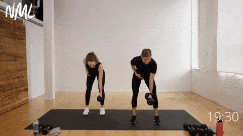 two women demonstrating row and uneven squat press as part of functional training workout