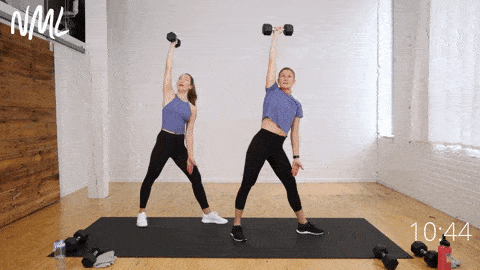 two women demonstrating a windmill exercise as part of functional core training workout