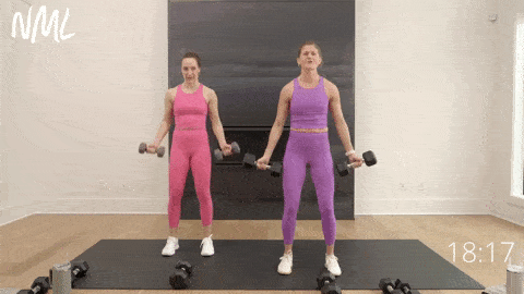 two women performing half bicep curls as part of Arm Toning Exercises for Females