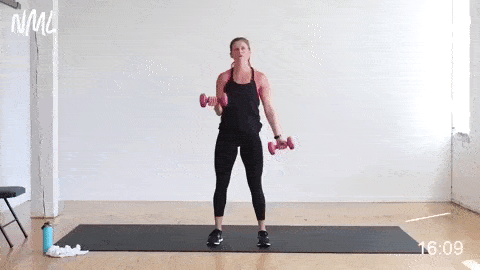 woman performing an isometric hold and single arm bicep curl