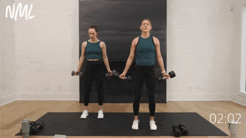 two women demonstrating bottom half bicep curls as part of best bicep exercises workout