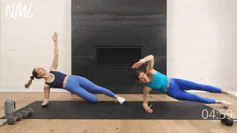 two women showing example of rolling side plank to target obliques