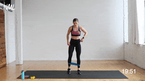 Women doing a three way squat stepping the left foot to the front, side and back during a resistance band exercise.