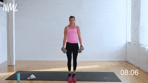 woman performing a weighted curtsy lunge and lateral lunge in a full body strength workout