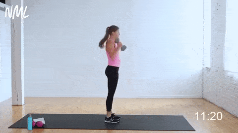 woman performing a dumbbell deadlift and clean squat in a full body strength workout no repeats