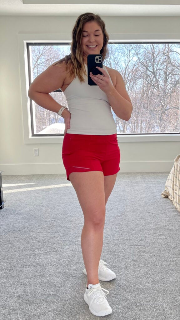 Woman posing in Hotty Hot Shorts as part of best lululemon shorts review post