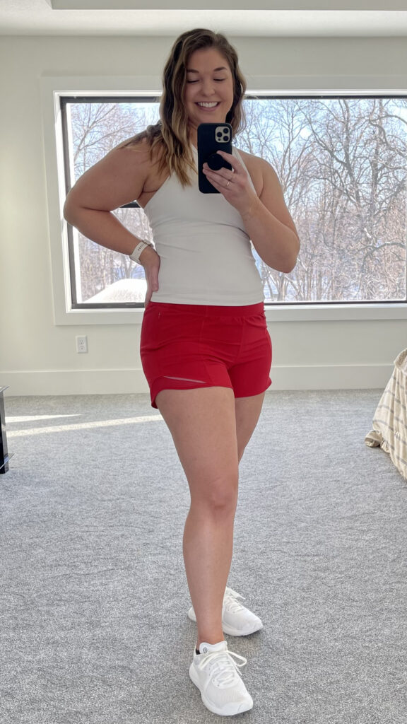 Woman posing in Hotty Hot Shorts as part of best lululemon shorts review post