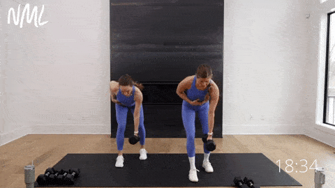 two women performing single arm back rows with dumbbells