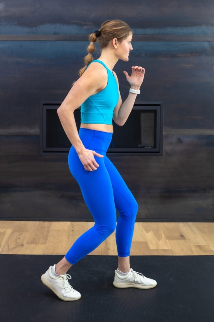 woman walking backwards as example of knee strengthening exercise