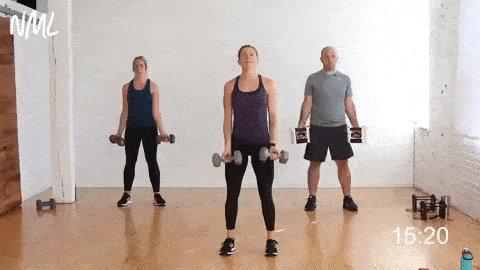 three people performing dumbbell bicep curls and standing chest flys in a total body dumbbell workout at home