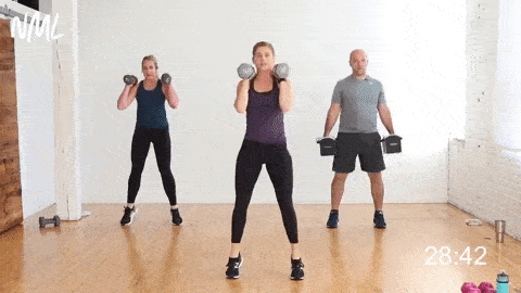 three people performing a 2-pulse squat and calf raise with dumbbells in a full body strength workout