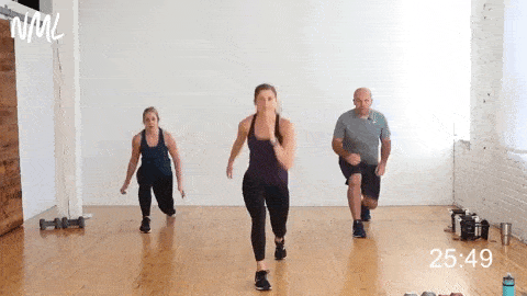three people performing double lunge jumps in a full body cardio workout at home