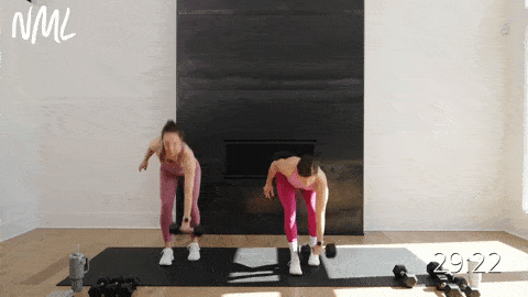 two women performing a staggered deadlift and clean squat in one dumbbell in a full body EMOM workout