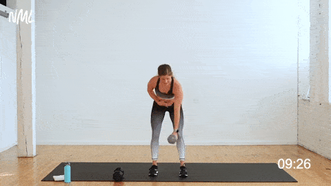 woman performing a single arm back row, bicep curl, and shoulder press as part of one dumbbell workout