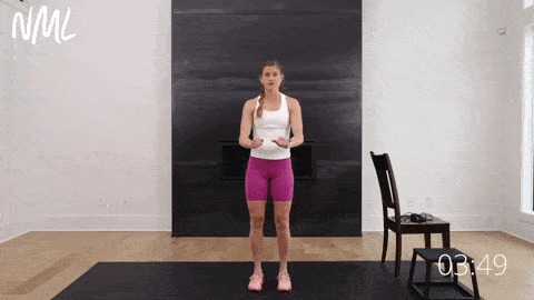 woman performing standing calf raises to strengthen calf muscles 