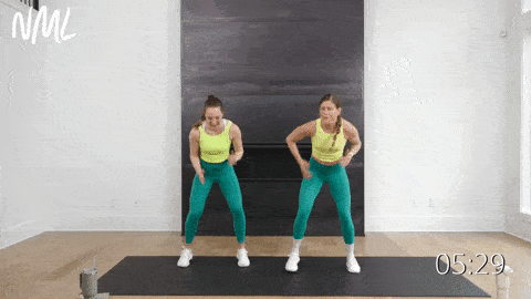 two women performing three fast feet and an alternating tap down in a standing cardio workout at home