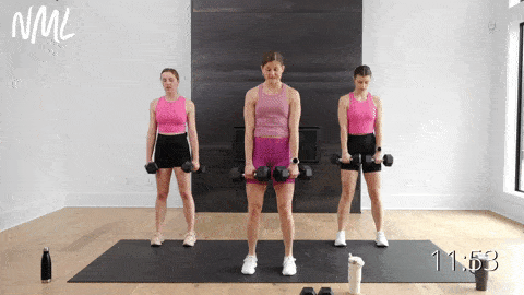 three women performing a double leg deadlift in a lower body strength workout with dumbbells