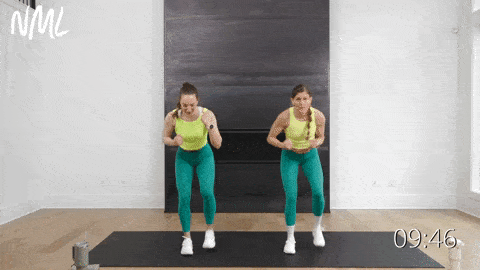 two women performing a front punch and tap back in a low impact cardio workout, no repeats