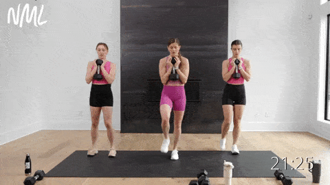 three women performing a front lunge to a reverse lunge in a lower body strength workout