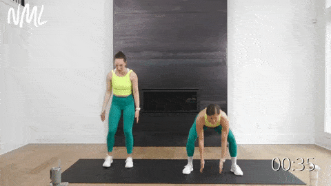 two women performing a squat jack and jumping jack in a low impact cardio workout at home