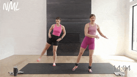 two women performing standing leg lifts as example of ankle weight exercise