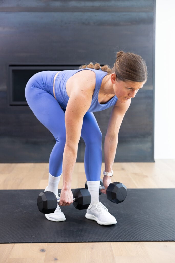 woman performing a staggered deadlift | stronger 25 day 5 full body strength and abs
