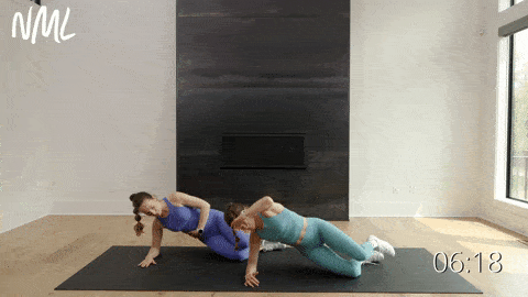 two women performing a modified side plank clamshell and leg lift in a daily ab workout