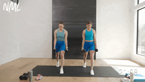 two women performing eccentric split lunges as example of eccentric leg workout