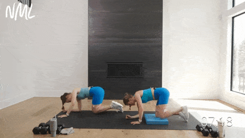 two women performing fire hydrant lifts as part of leg circuit workout