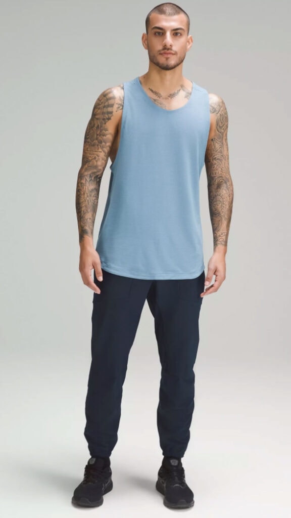 man wearing license to train tank as part of review of best mens lululemon tank tops