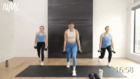 three women performing a split lunge and balance bicep curl as part of dumbbell strength training