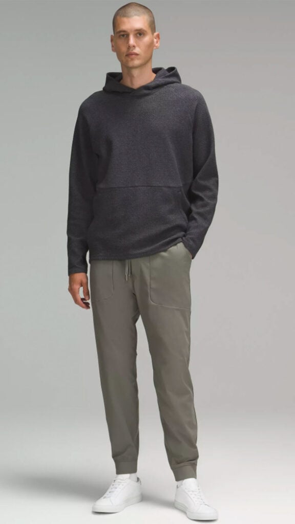 man wearing lulu mens pant to show what the ABC jogger looks like on