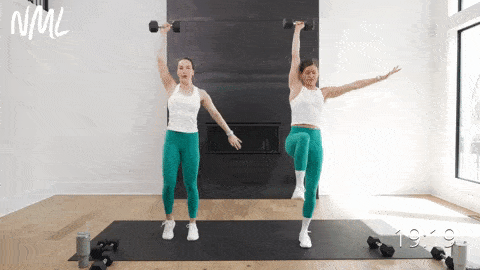Two women performing a single leg deadlift and snatch as part of standing workout