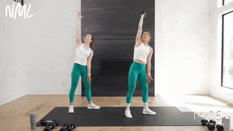 two women performing a windmill exercise