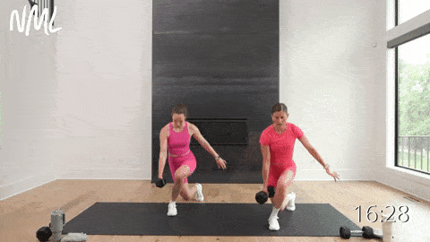 two women performing a curtsy lunge and lateral lunge in a total body HIIT workout