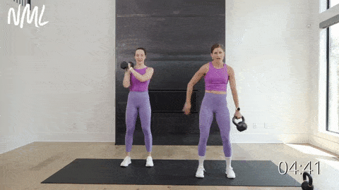 two women performing a kettlebell ab exercise - around the world and kettlebell clean