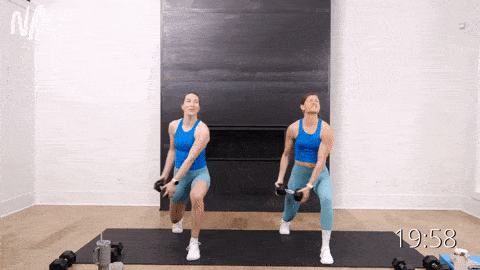 two women performing a lunge hold with a crossbody chop as example of unilateral ab exercise