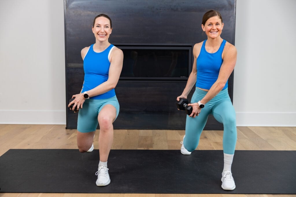 two women performing a lunge hold and cross body rotation as example of unilateral core exercise