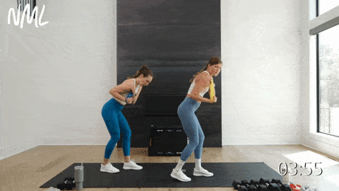 two women performing banded tricep push downs as part of the best tricep exercises
