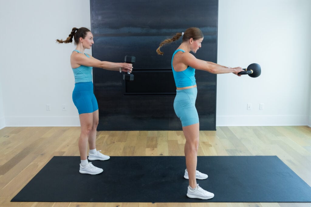 two women performing a kettlebell swing in a kettlebell workout for women