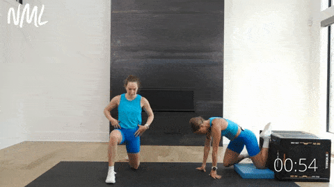 two women performing a couch stretch as example of best mobility exercises